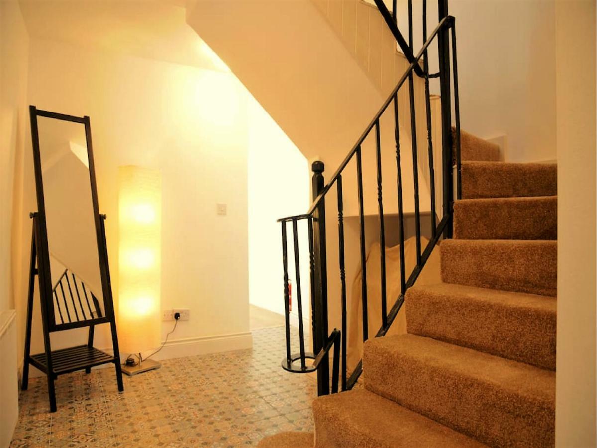Dingle Garden Townhouse Bed & Breakfast Exterior photo A staircase with a handrail